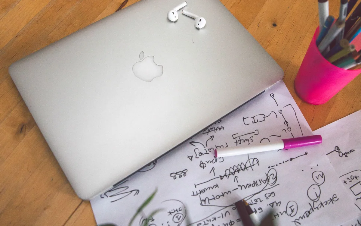 Laptop and notebooks on a desk