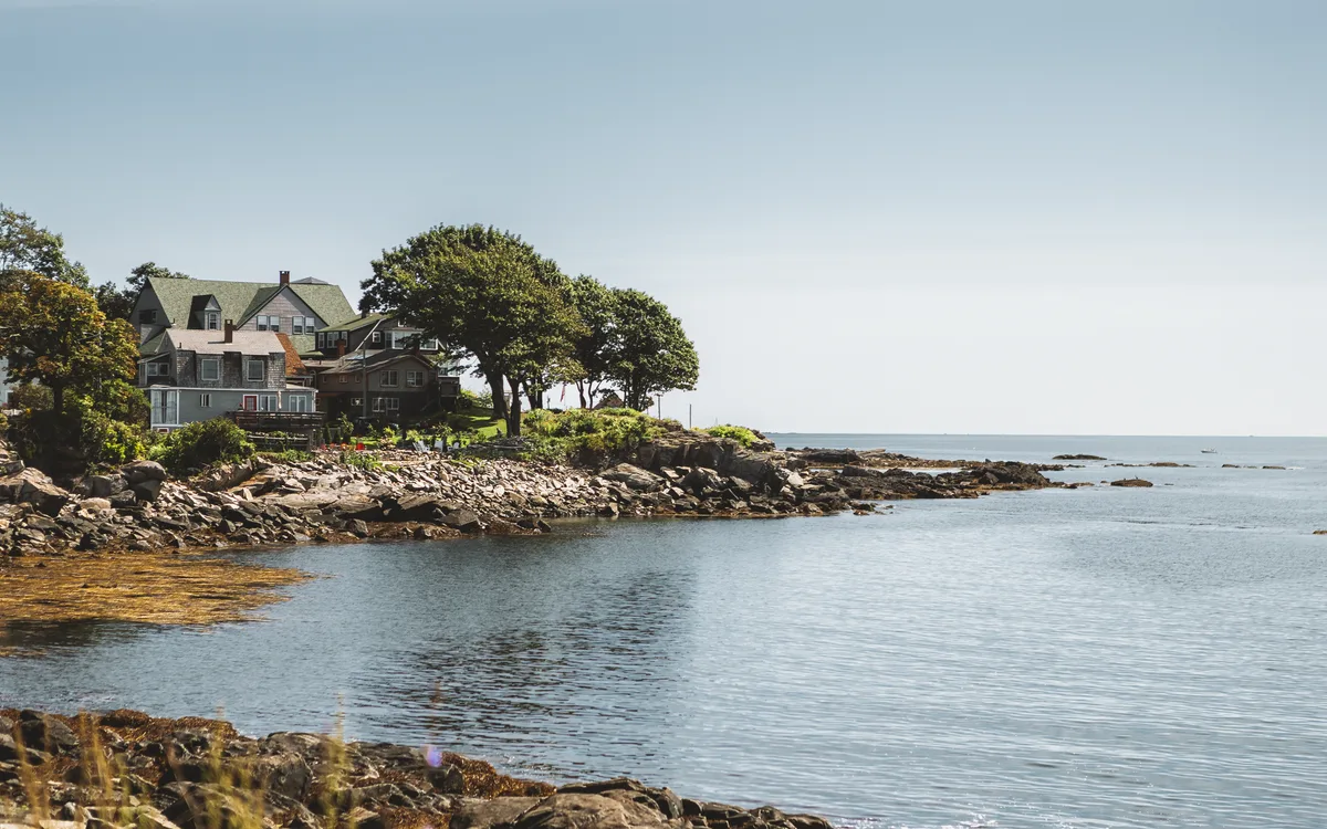 Coastal homes beside the rocky shoreline in Portland, Maine