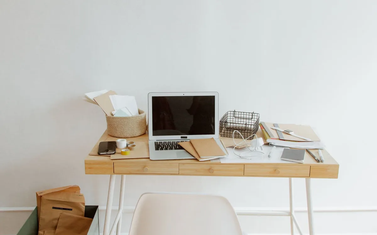 Home workspace with a laptop and office supplies